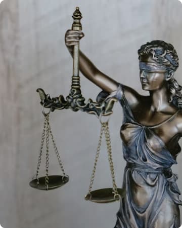Lady Justice statue with scales of justice representing Satyarup Law Firm