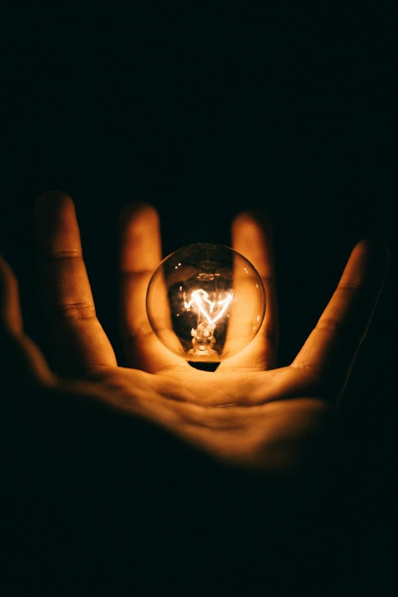 Illuminated filament bulb symbolizing intellectual property and patent protection